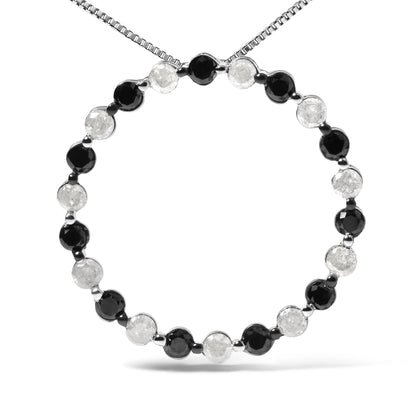 Front-facing shot of a white metal necklace with alternating round black and white gemstones in prong settings forming a circle.