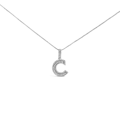 Front-facing shot of a white metal necklace with a letter C-shaped pendant encrusted with two rows of round white gemstones on the pendant and additional gemstones on the bail.