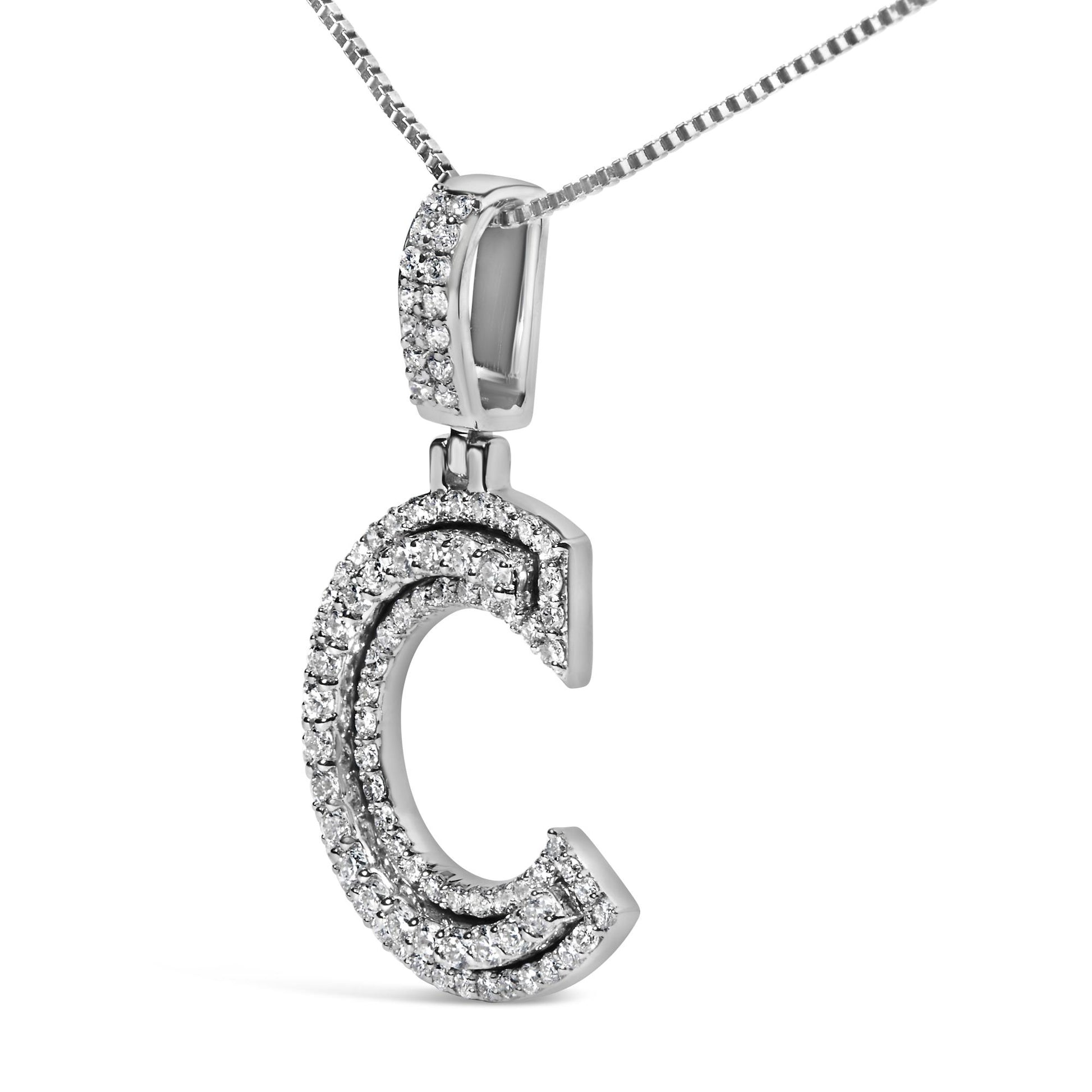 Close-up front-side angle of a white metal necklace pendant shaped like the letter C, adorned with two rows of round white gemstones in prong settings, hanging from a white metal chain.
