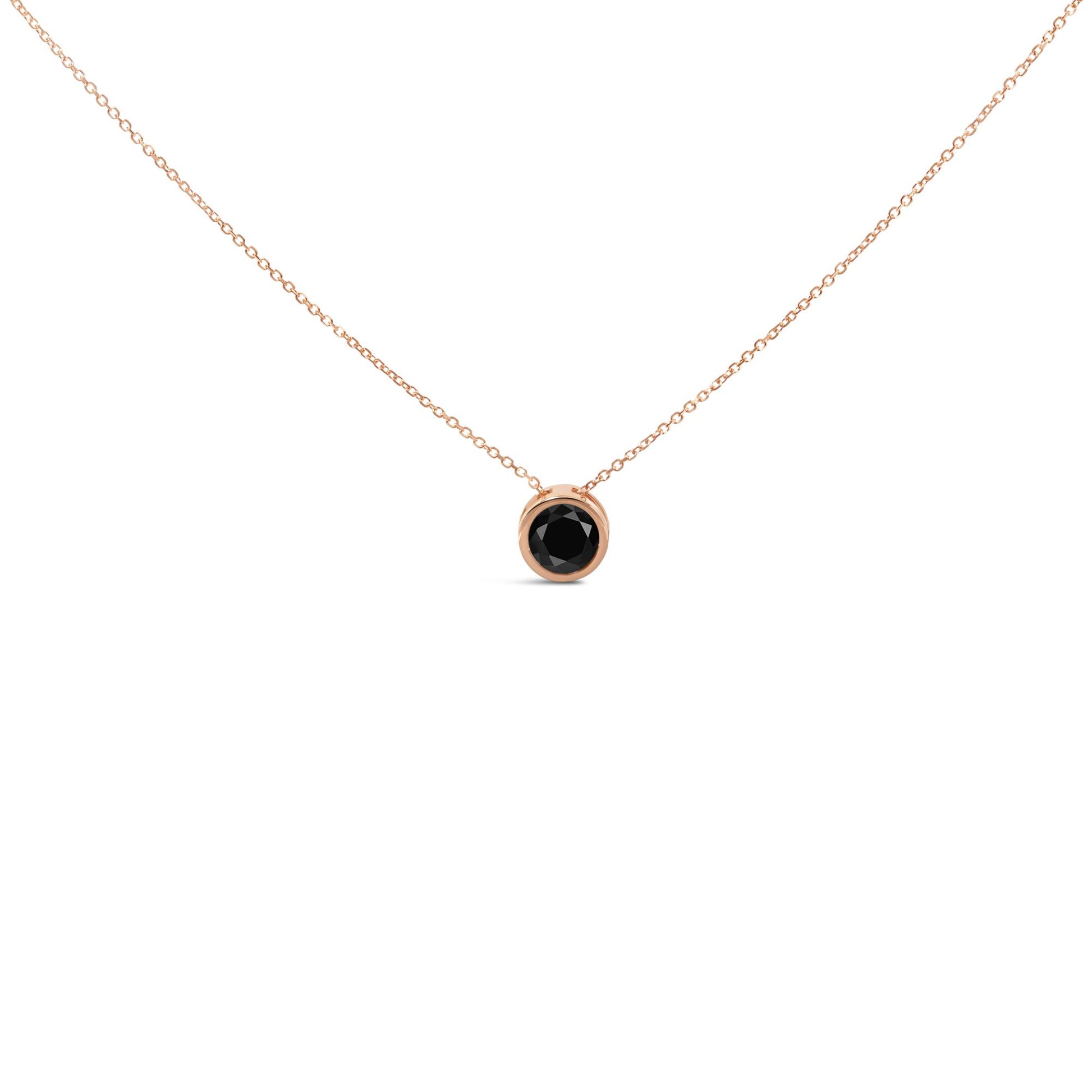 Rose metal necklace with round black gemstone in bezel setting, front angle.