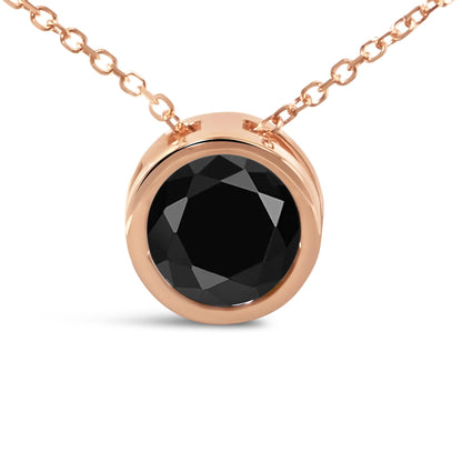 Close-up front angle of a rose metal necklace with a round black gemstone in bezel setting.