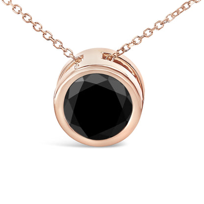 Close-up front angle of a rose metal necklace with a round black gemstone in a bezel setting.
