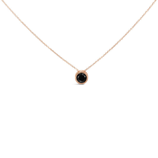 Front view of a rose metal necklace with a round black gemstone in a bezel setting pendant.