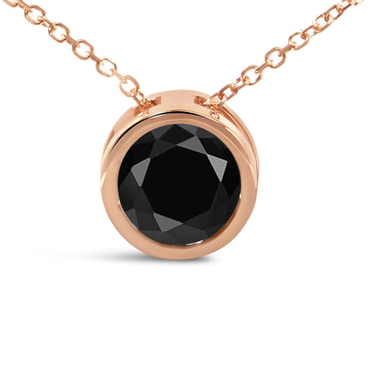 Close-up front view of a rose metal necklace with a round black gemstone in a bezel setting.