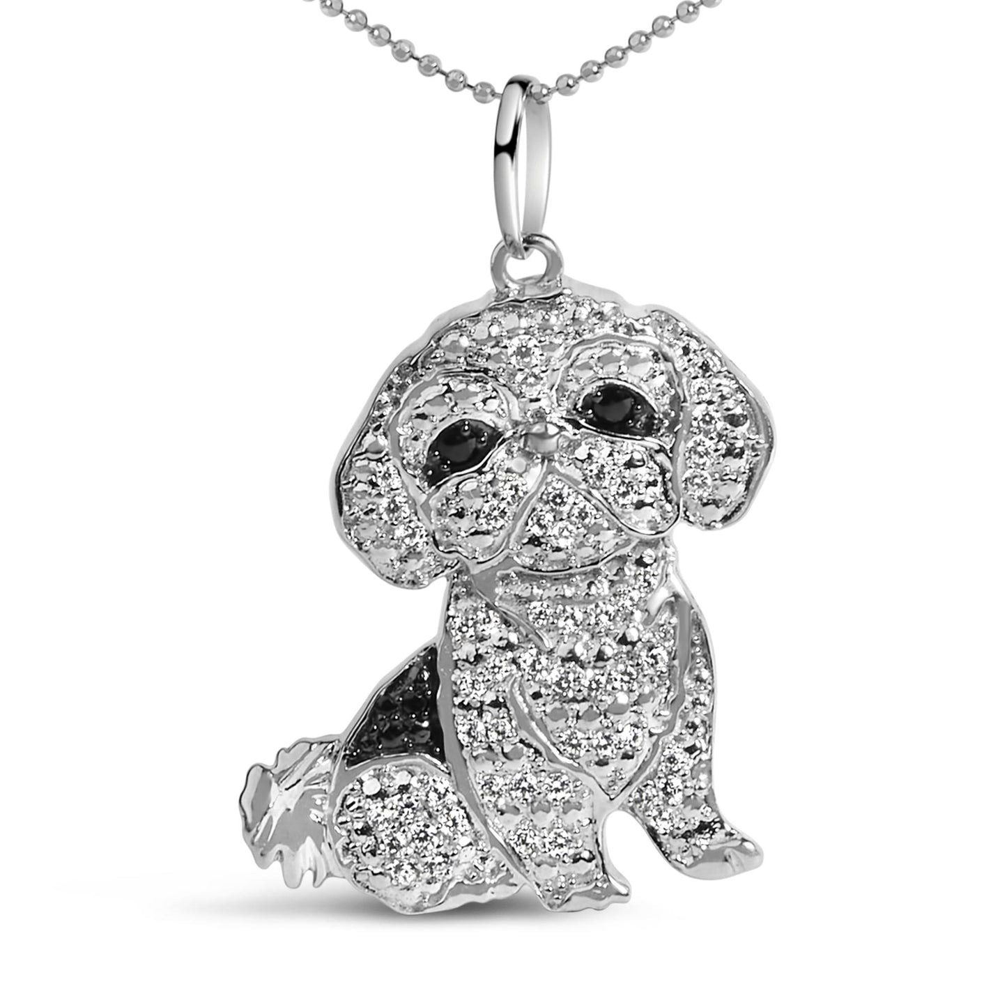 Close-up front view of a white metal necklace pendant shaped like a sitting dog, decorated with round white gemstones in a micro-pave setting and accented with round black gemstones for the eyes and patches.