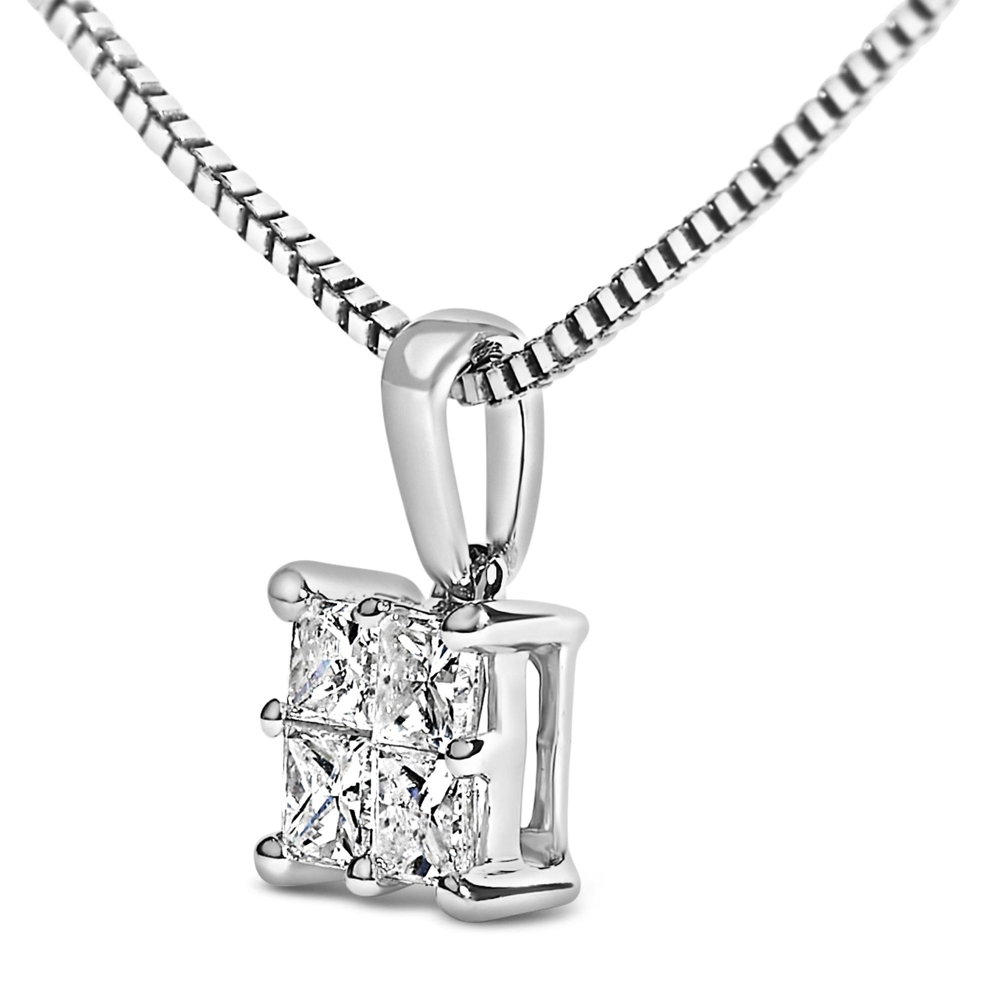 Close-up front angle of a white necklace pendant featuring four princess-shaped white gemstones in an invisible setting.