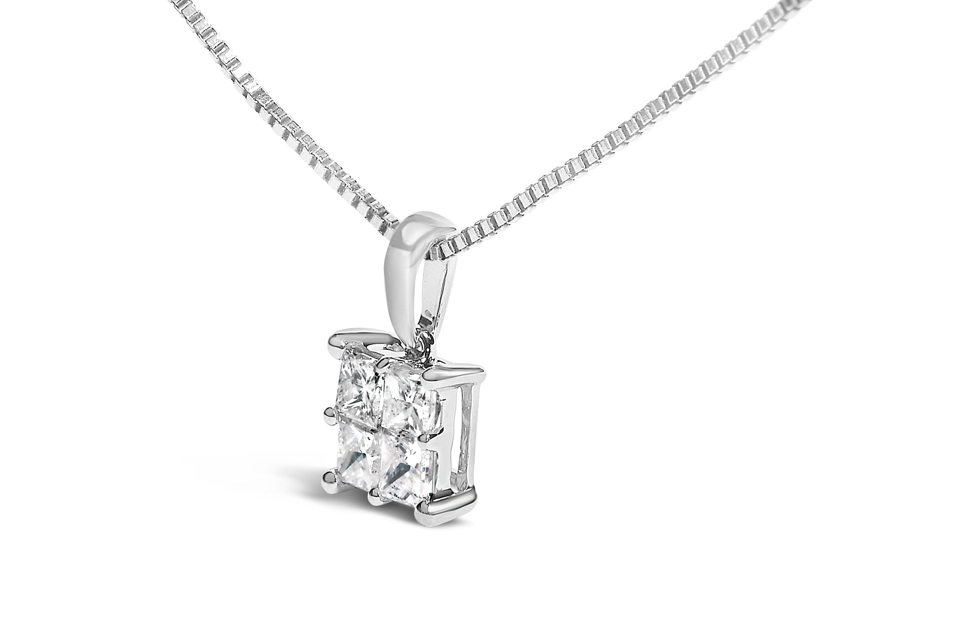 Close-up front angle of a white metal necklace with a pendant featuring four princess-shaped white gemstones in an invisible setting.