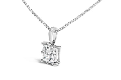 Close-up front angle of a white metal necklace with a pendant featuring four princess-shaped white gemstones in an invisible setting.