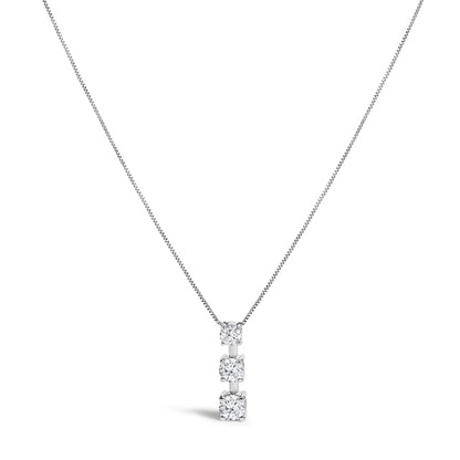 Front view of a white metal necklace with a fine chain and a vertical pendant featuring three white round gemstones in prong and miracle settings, shown on a white background.