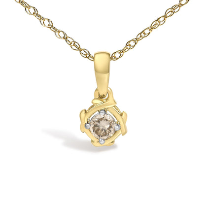 Close-up front view of a yellow metal necklace with a pendant featuring an abstract frame holding a round white gemstone in prong setting.