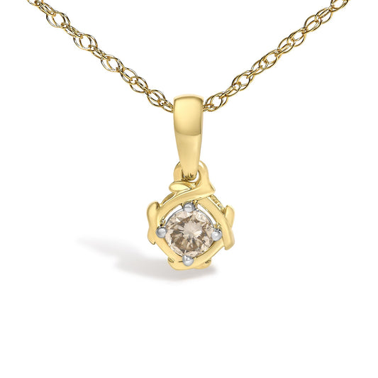 Close-up front view of a yellow metal necklace with a pendant featuring an abstract frame holding a round white gemstone in prong setting.