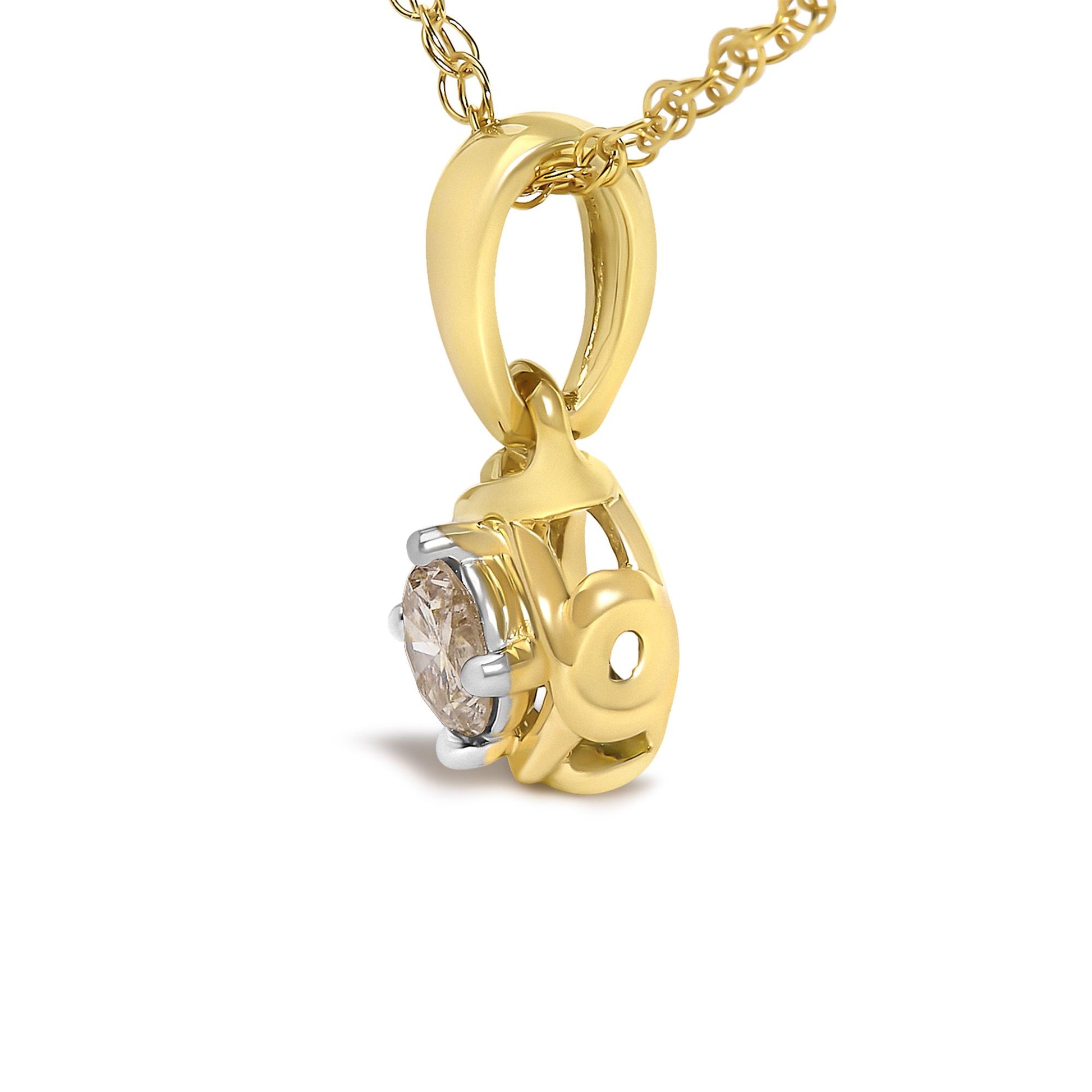Close-up side angle of a yellow metal necklace pendant featuring a round white gemstone in a prong setting.