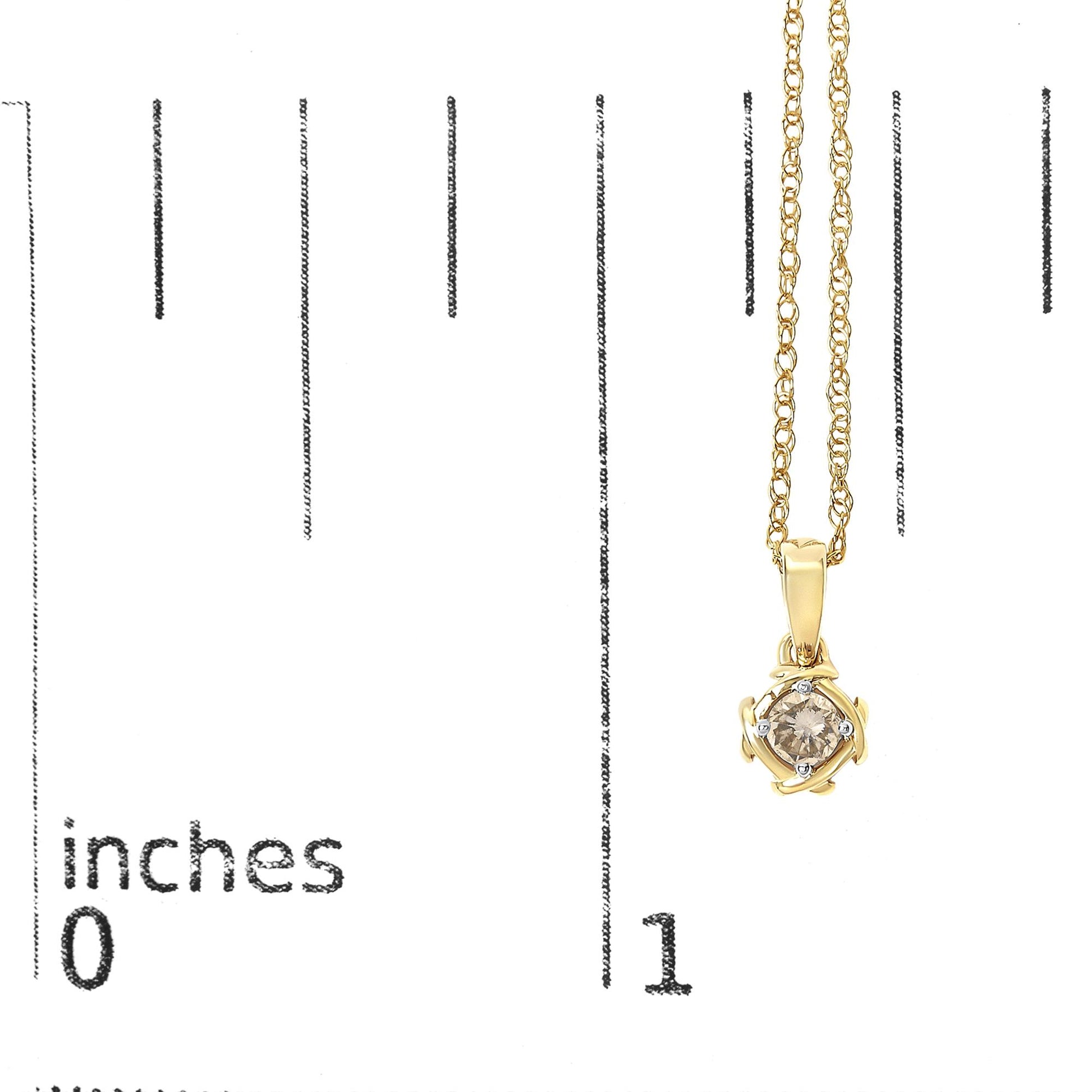 Close-up front view of a yellow metal necklace with a round white gemstone in a prong setting pendant, shown on a scale marked in inches.