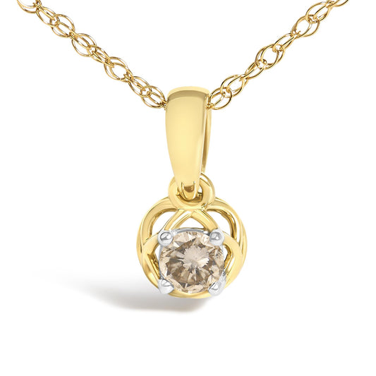 Close-up front view of a yellow necklace with a single round white gemstone in prong setting, featuring an intricate circular pendant design.