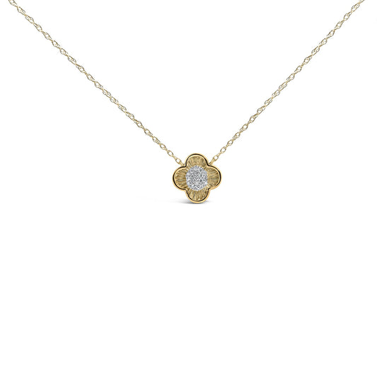 Close-up front view of a yellow metal necklace with a flower-shaped pendant featuring clustered white round gemstones in the center, shown on a white background.