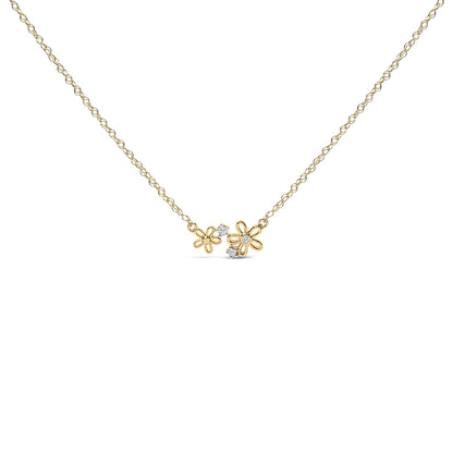 Yellow metal necklace shown from the front with two flower-shaped pendants, each featuring small white gemstones in prong settings.