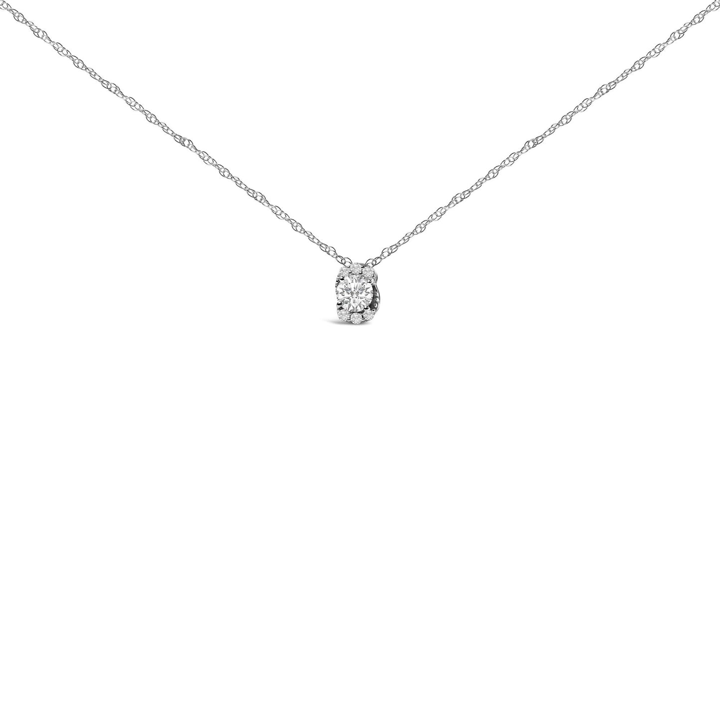 Front-facing close-up of a white necklace with a pendant featuring one round white gemstone surrounded by smaller round white gemstones in a prong setting.