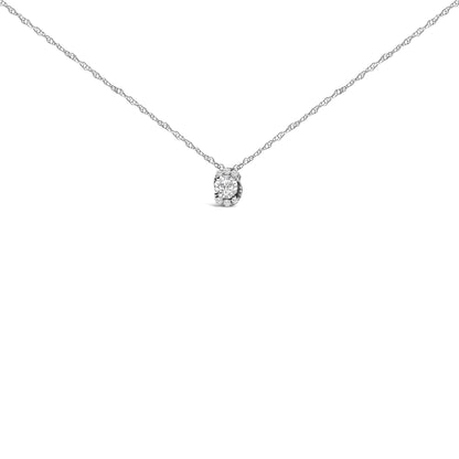 Front-facing close-up of a white necklace with a pendant featuring one round white gemstone surrounded by smaller round white gemstones in a prong setting.