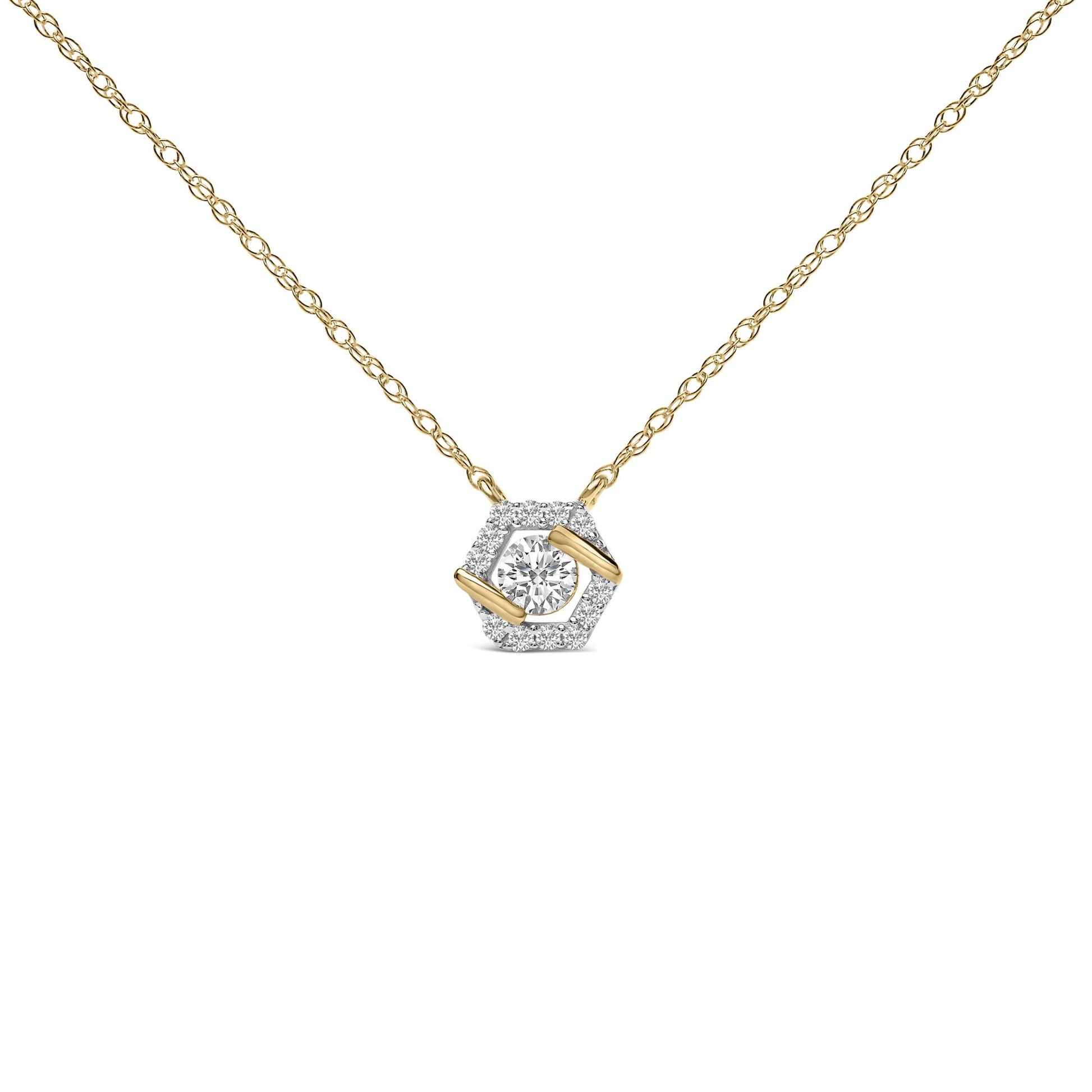 Close-up front view of a yellow metal necklace with a hexagonal pendant featuring one round white gemstone in the center held by two prongs and surrounded by smaller round white gemstones in a prong setting.