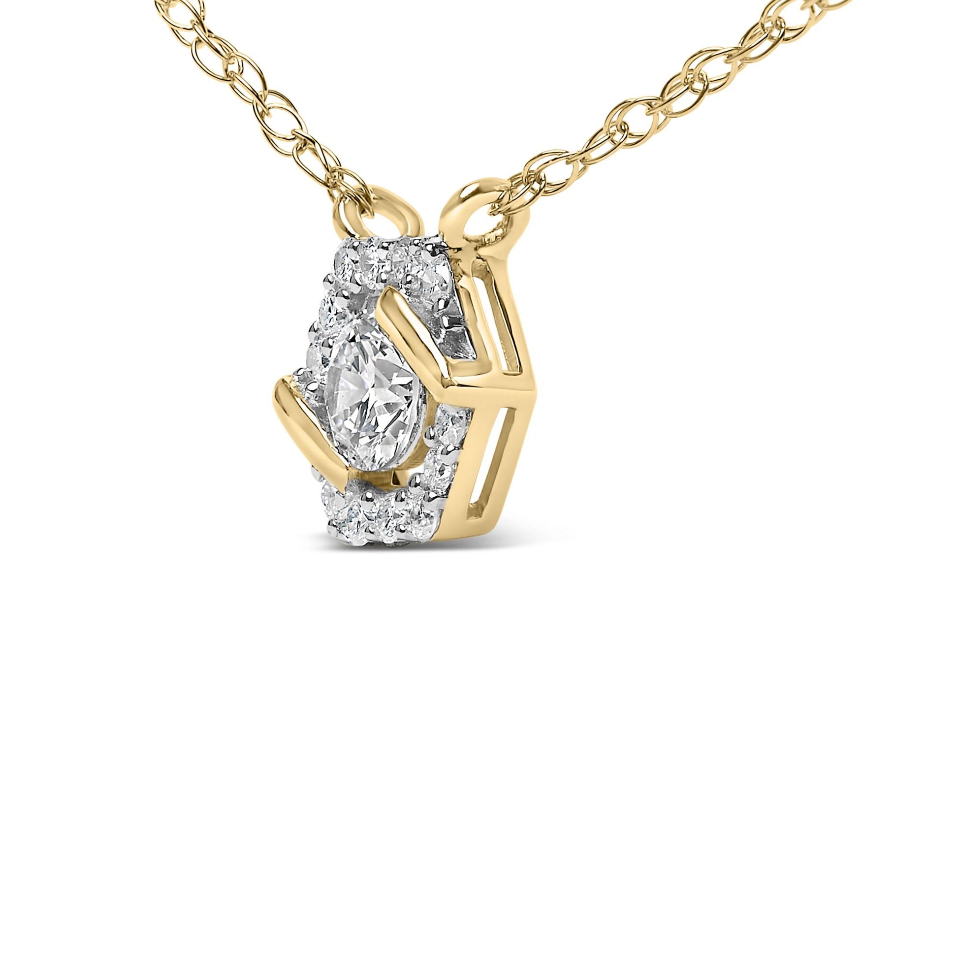Close-up front angle of a yellow metal necklace with a pendant featuring a single marquise-shaped white gemstone surrounded by multiple smaller round white gemstones in prong settings.