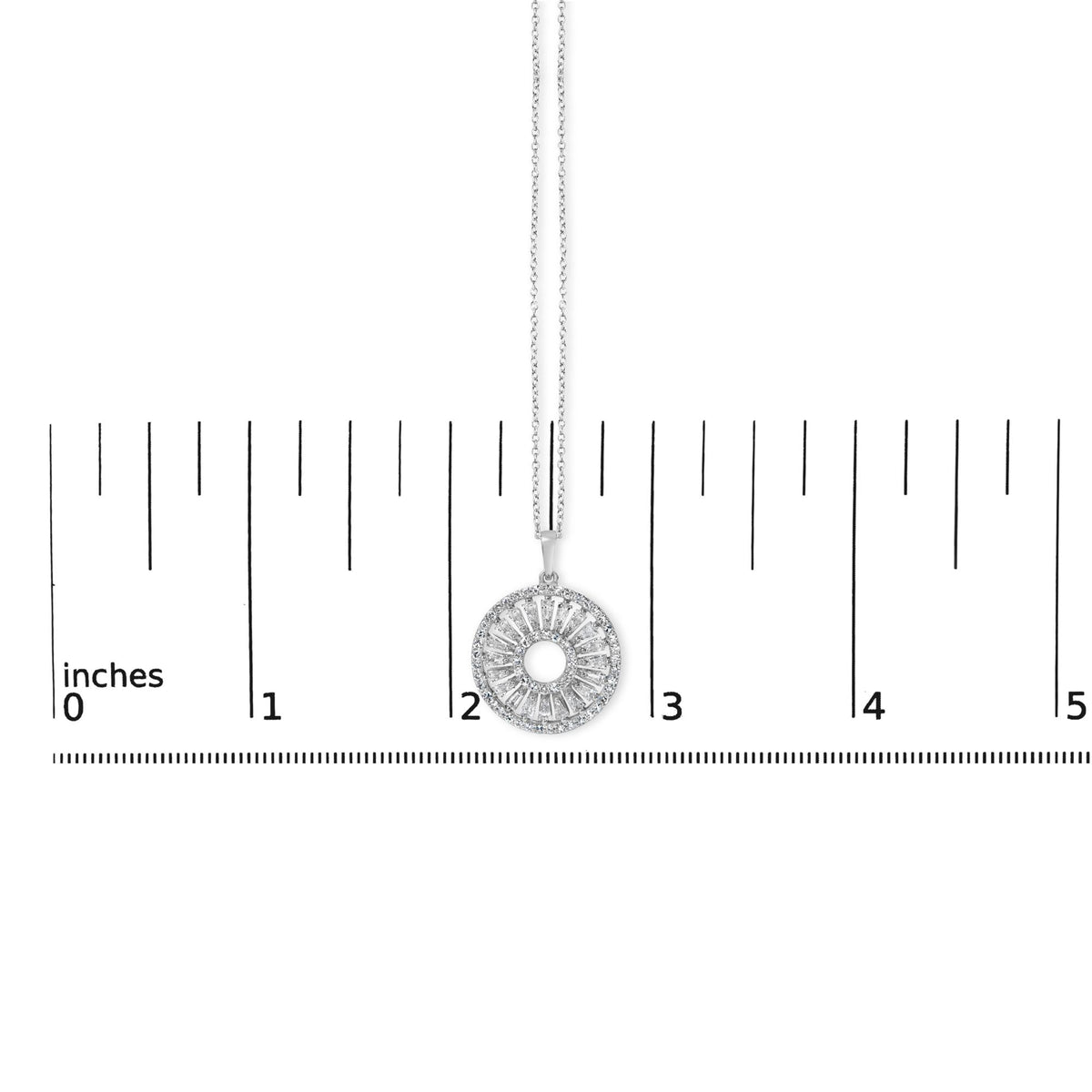 White metal necklace with a round pendant featuring prong-set white baguette and round gemstones, shown on a scale from above.