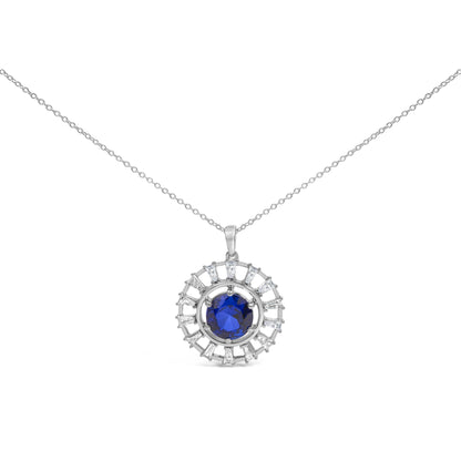 Front view of a white metal necklace pendant with a round blue gemstone center surrounded by a circle of white baguette-shaped gemstones in prong settings, shown on a chain against a white background.