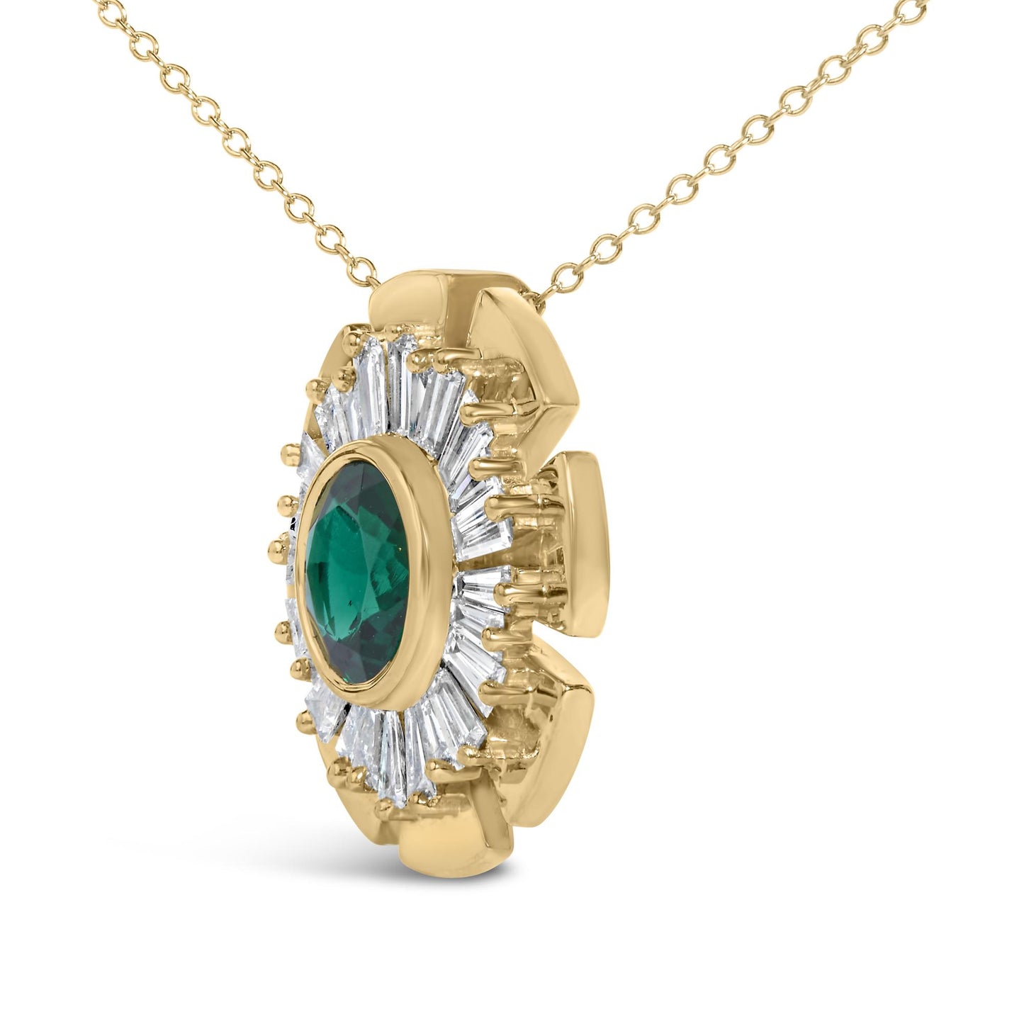 Close-up front angle of a yellow metal necklace pendant featuring a round green gemstone in a bezel setting surrounded by white baguette-shaped gemstones in prong settings.