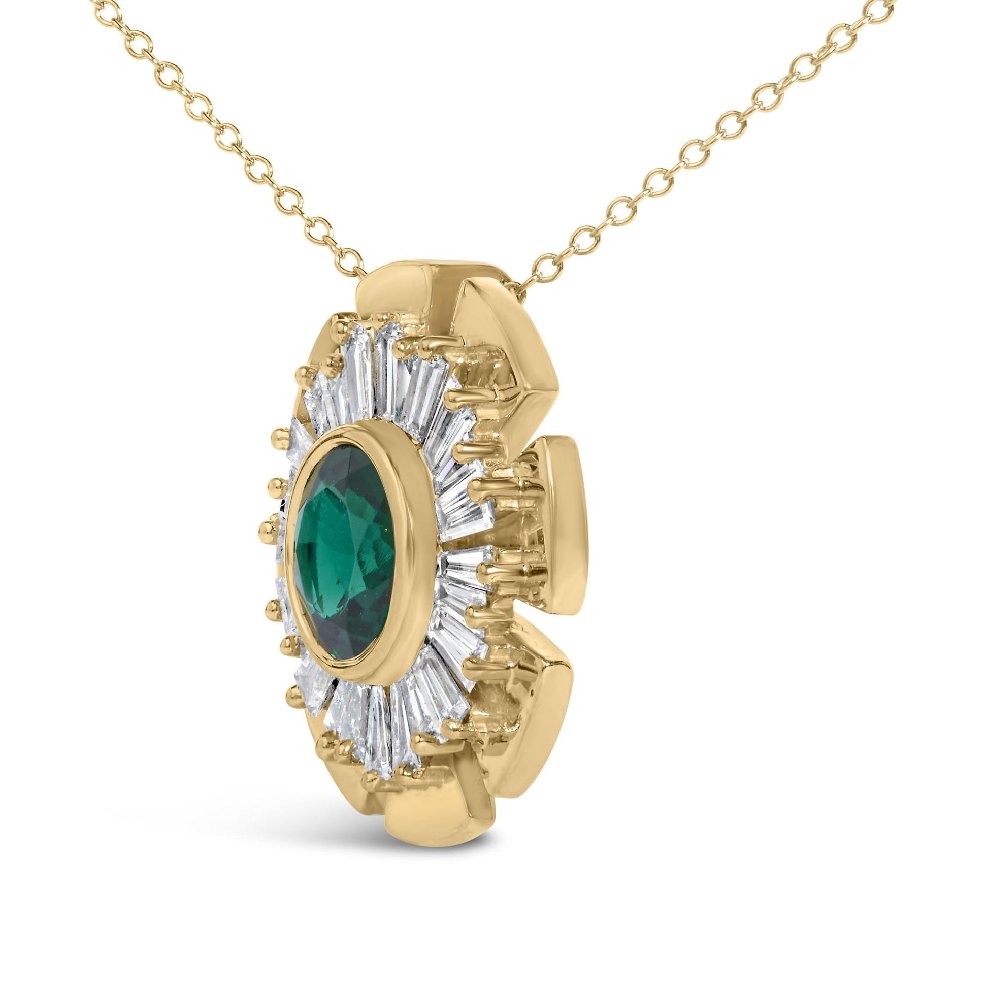 Close-up front angle of a yellow metal necklace pendant featuring a round green gemstone in a bezel setting surrounded by white baguette-shaped gemstones in prong settings.
