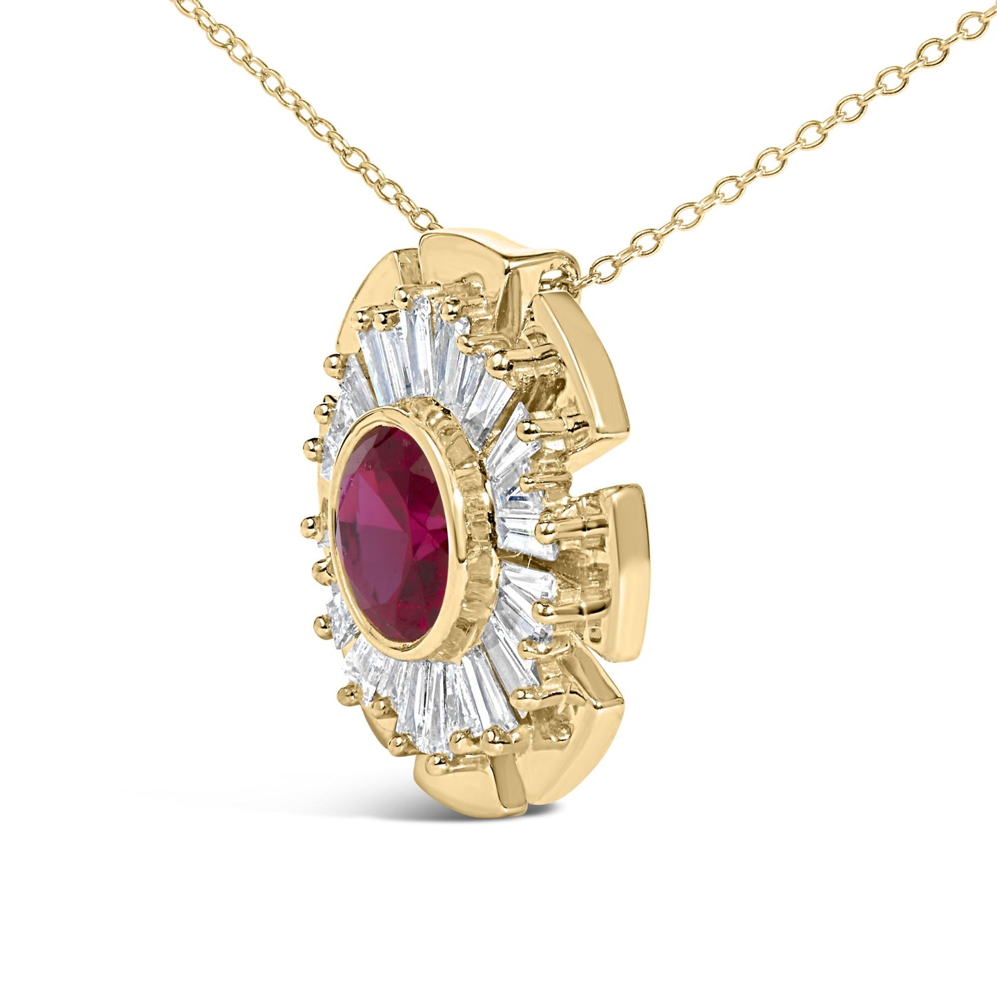 Close-up angled view of a yellow metal necklace pendant with a large oval red gemstone bezel-set in the center, surrounded by prong-set white baguette-shaped gemstones arranged in a circular pattern.