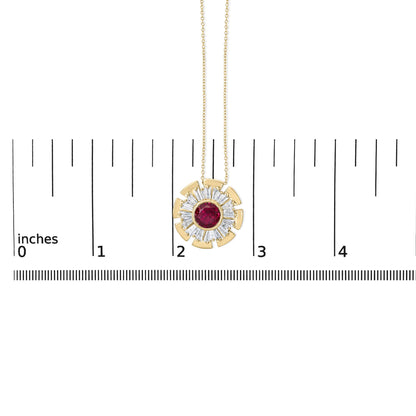 Close-up front view of a yellow metal necklace pendant with a round red gemstone bezel set in the center, surrounded by prong-set white baguette-shaped gemstones in a circular pattern, shown on a scale.