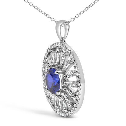 Close-up front right angle view of a white metal necklace pendant featuring a large oval blue gemstone center surrounded by alternating round white gemstones and baguette-shaped white gemstones in prong settings, shown on a white background.