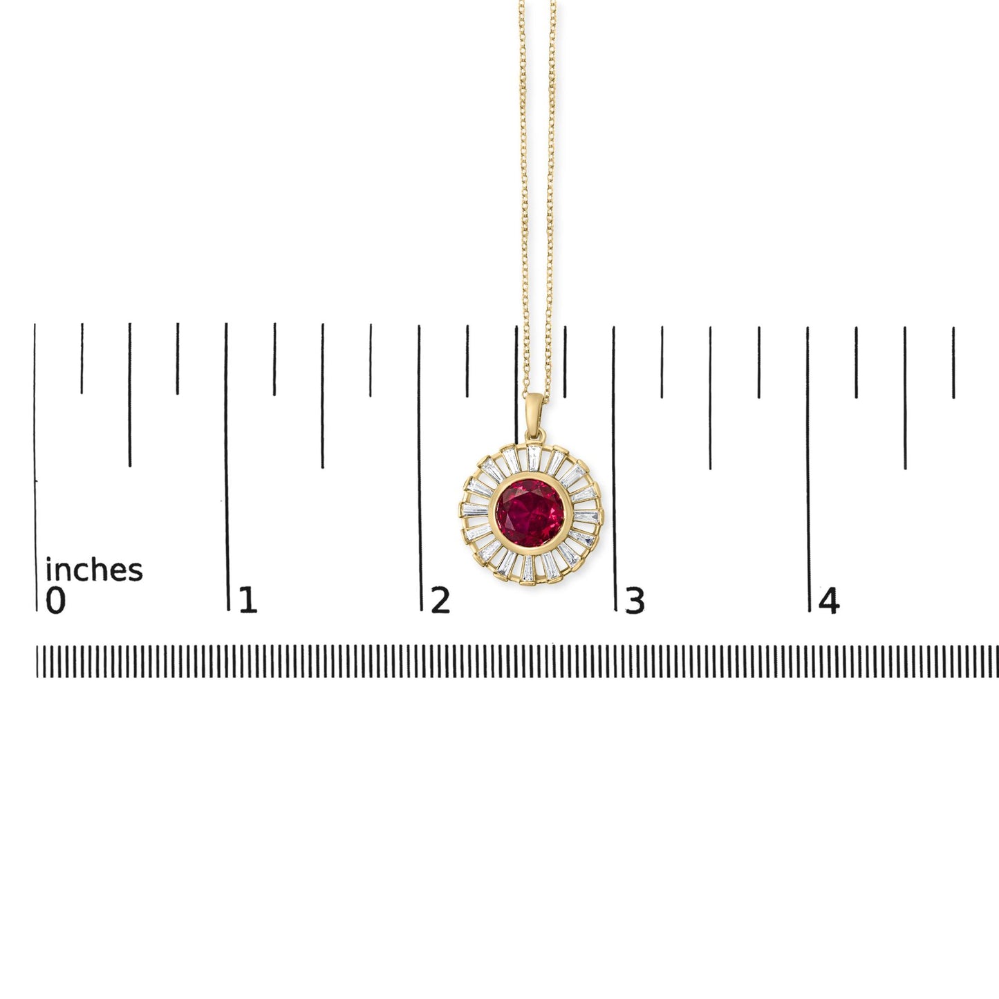 Close-up front view of a yellow necklace pendant shown on a measurement scale, featuring a round red gemstone center surrounded by white baguette-shaped gemstones in a channel setting.