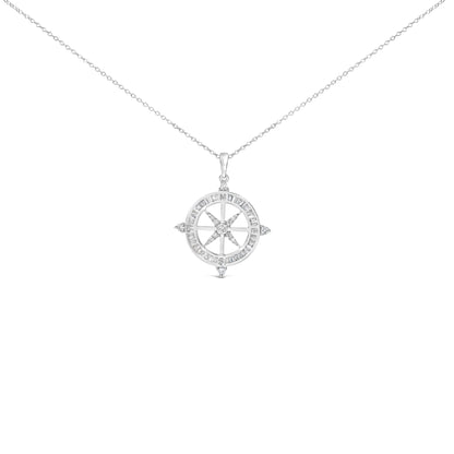 Close-up front view of a white metal necklace with a circular compass pendant featuring white baguette-shaped gemstones in channel settings around the outer edge and white round-shaped gemstones in prong settings forming the compass points.