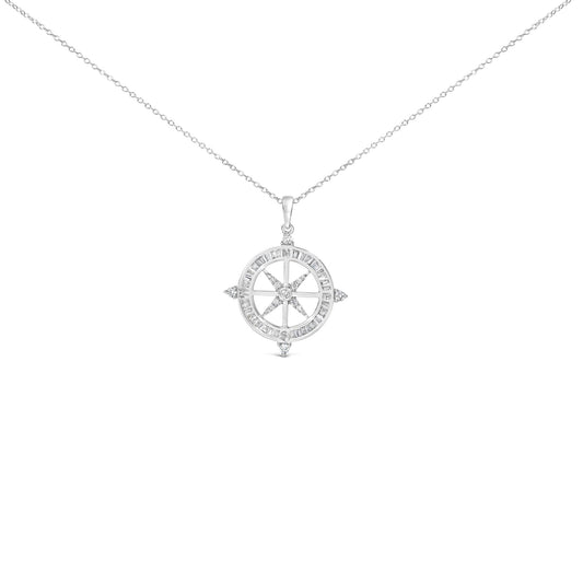 Close-up front view of a white metal necklace with a circular compass pendant featuring white baguette-shaped gemstones in channel settings around the outer edge and white round-shaped gemstones in prong settings forming the compass points.