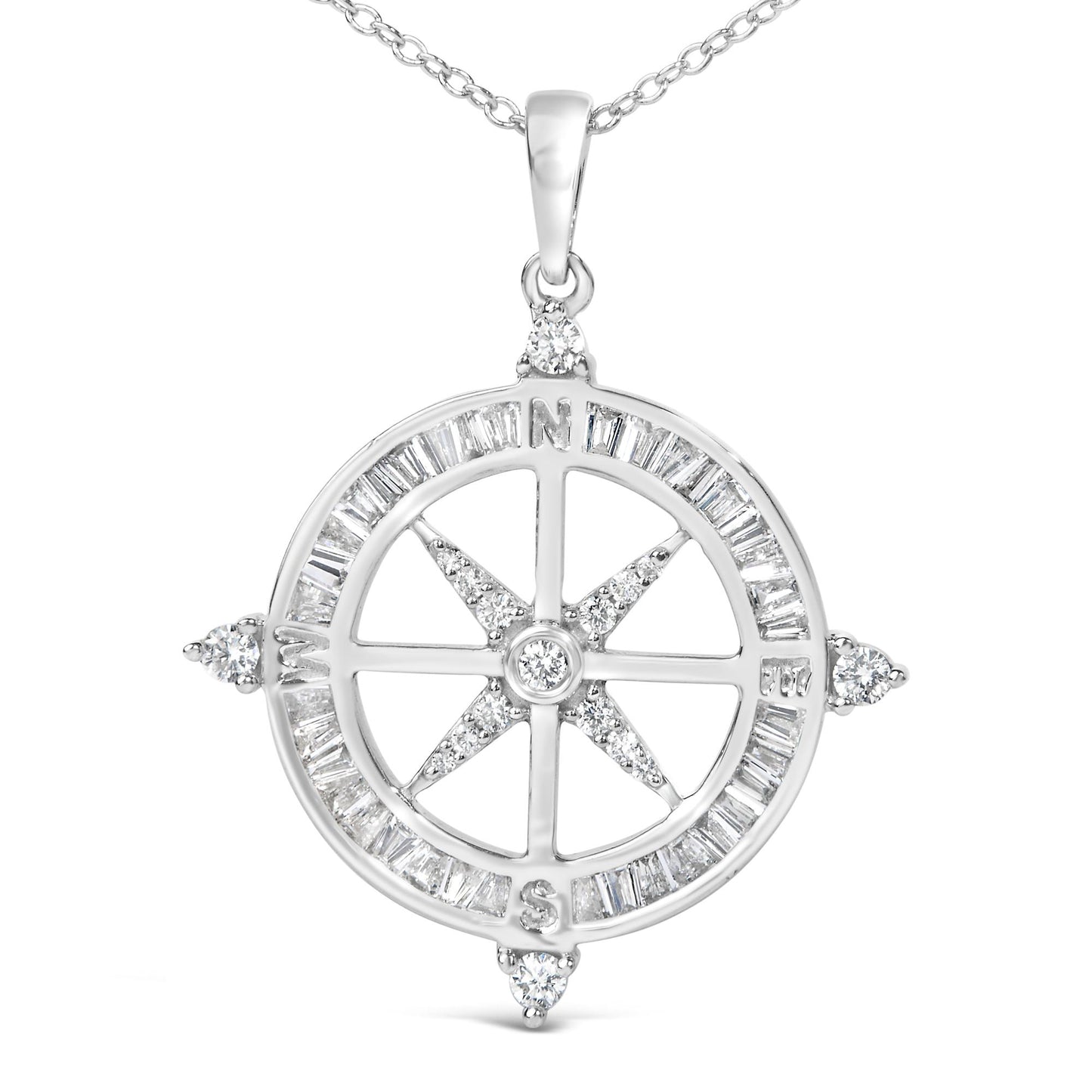 Close-up front view of a white metal compass pendant necklace featuring white baguette-shaped gemstones in a channel setting around the outer circle and white round-shaped gemstones in prong settings at the four cardinal points and center.
