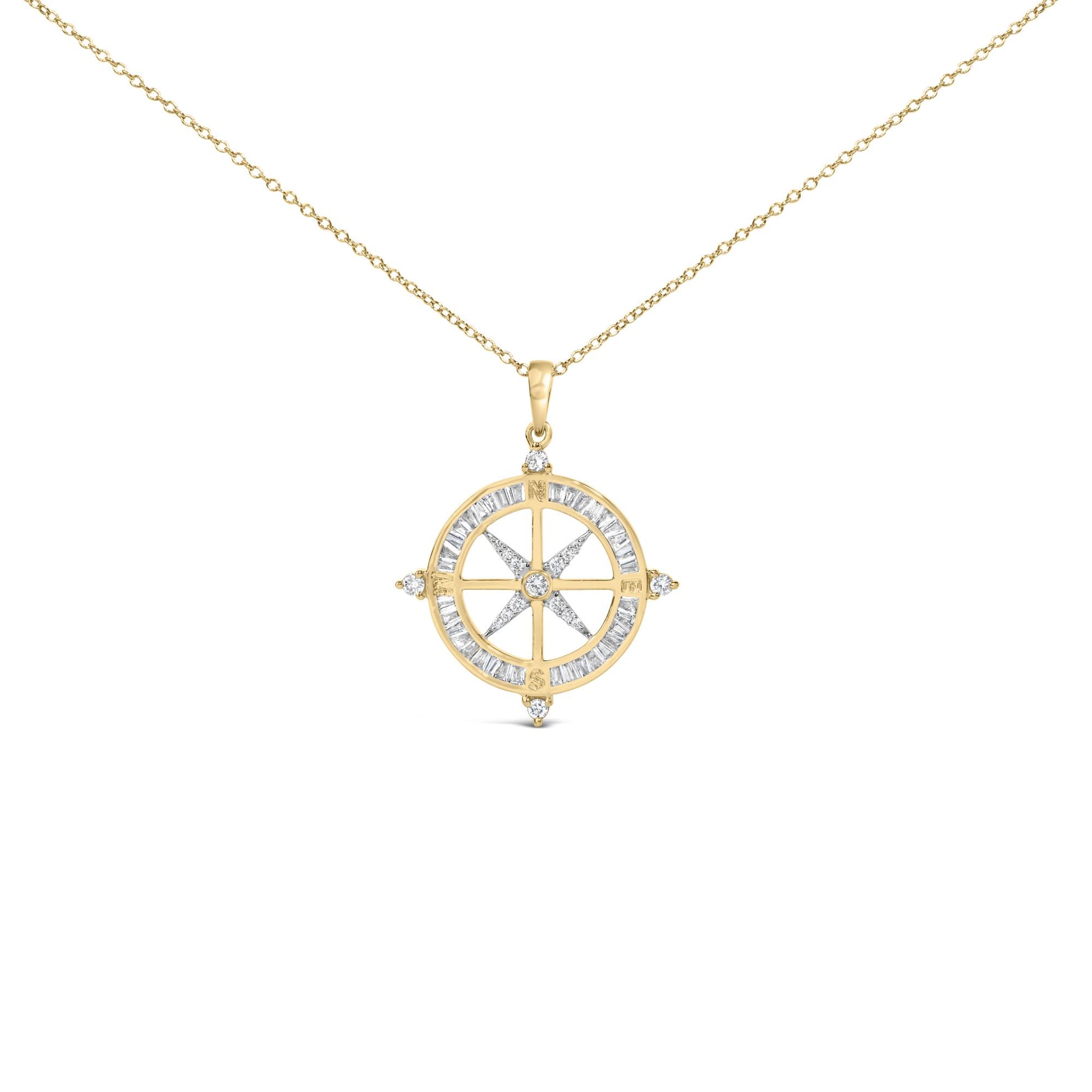 Close-up front view of a yellow necklace with a round pendant featuring a compass design. The pendant is adorned with white baguette-shaped gemstones in a channel setting around the circle and accented with round white gemstones in a prong setting at the cardinal points and center.