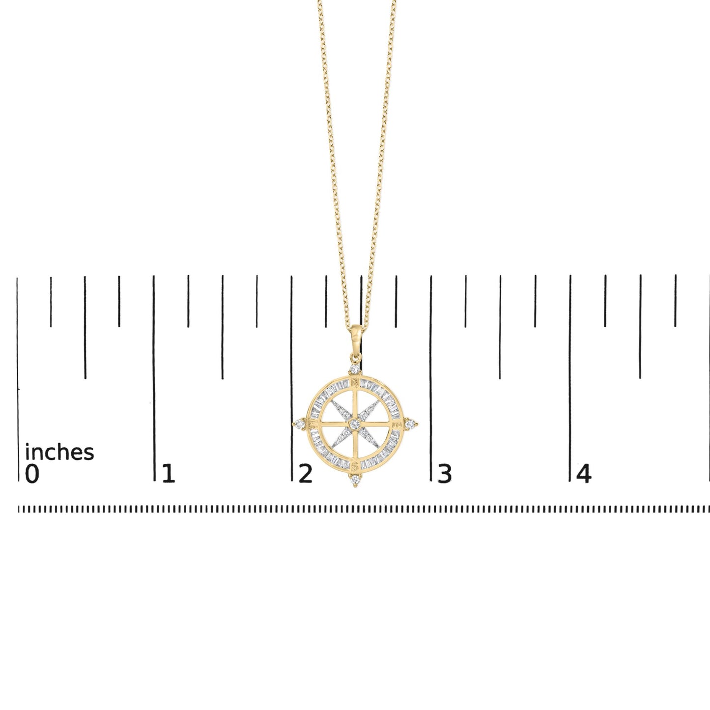 Yellow metal necklace with a round compass-shaped pendant featuring white baguette and round gemstones, shown on a scale with a front angle.