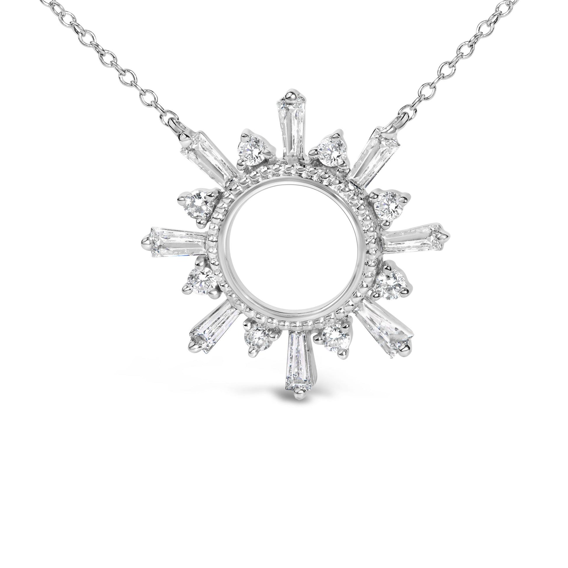 Close-up front view of a white metal necklace pendant with a circular center, surrounded by alternating prong-set white round and baguette-shaped gemstones, shown on a white background.
