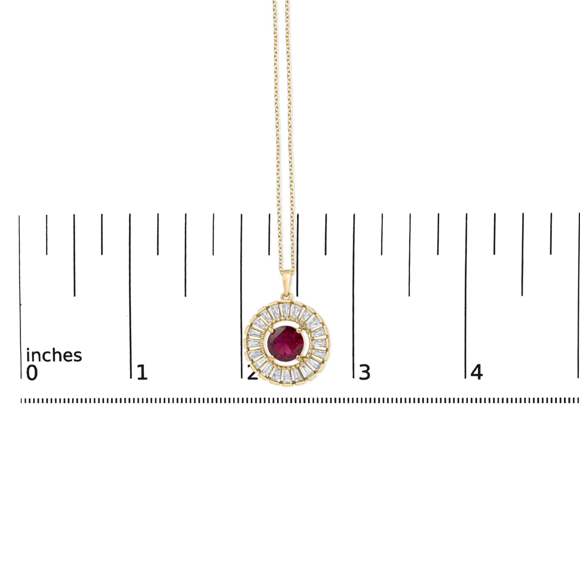 Close-up front view of a yellow metal necklace with a circular pendant featuring a central red round gemstone surrounded by a halo of white baguette-shaped gemstones in a channel setting, shown on a scale.