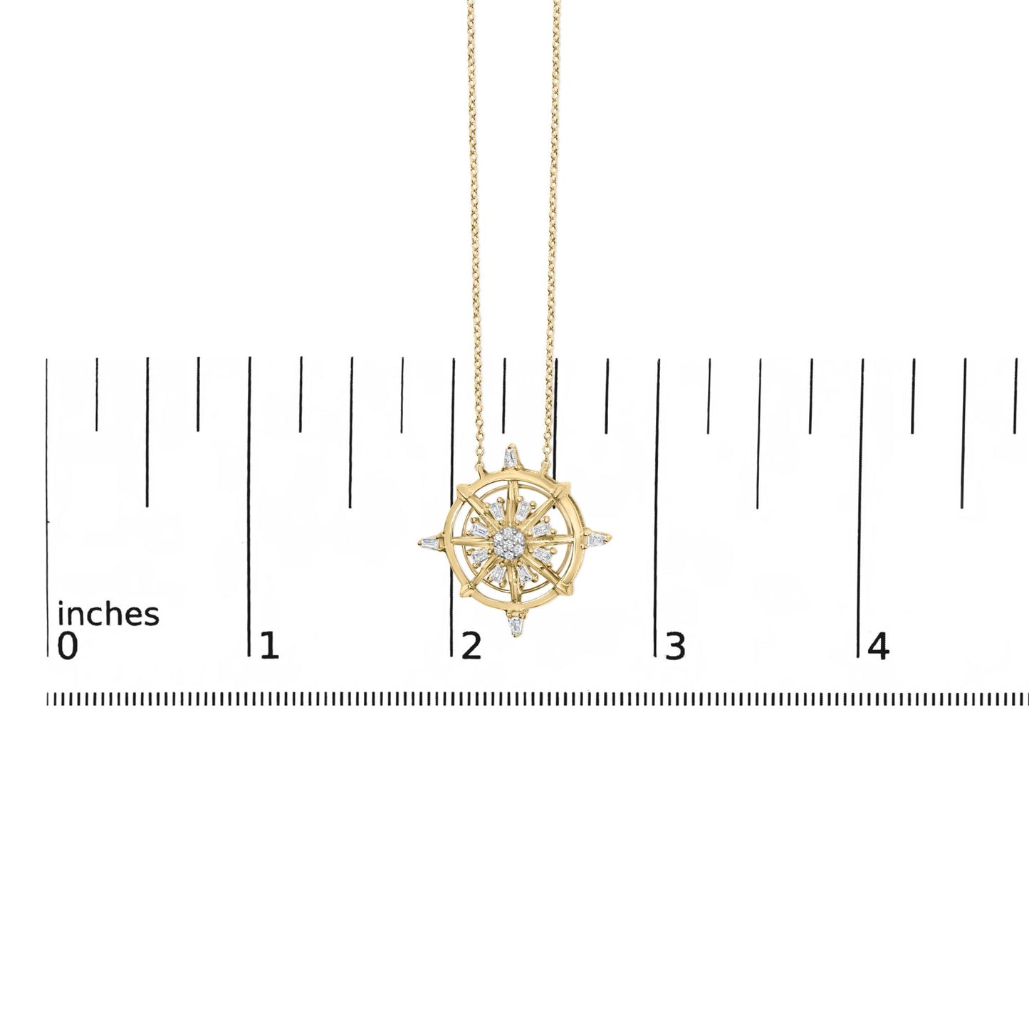 Close-up front view of a yellow necklace pendant with a circular sunburst design featuring white round and baguette-shaped gemstones, shown on a scale.
