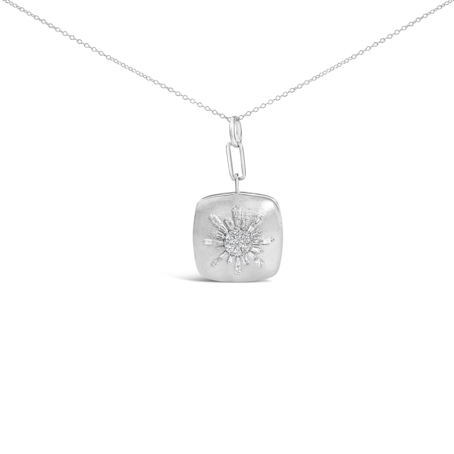Close-up front view of a white necklace chain with a pendant featuring a sunburst design of baguette and round white gemstones.