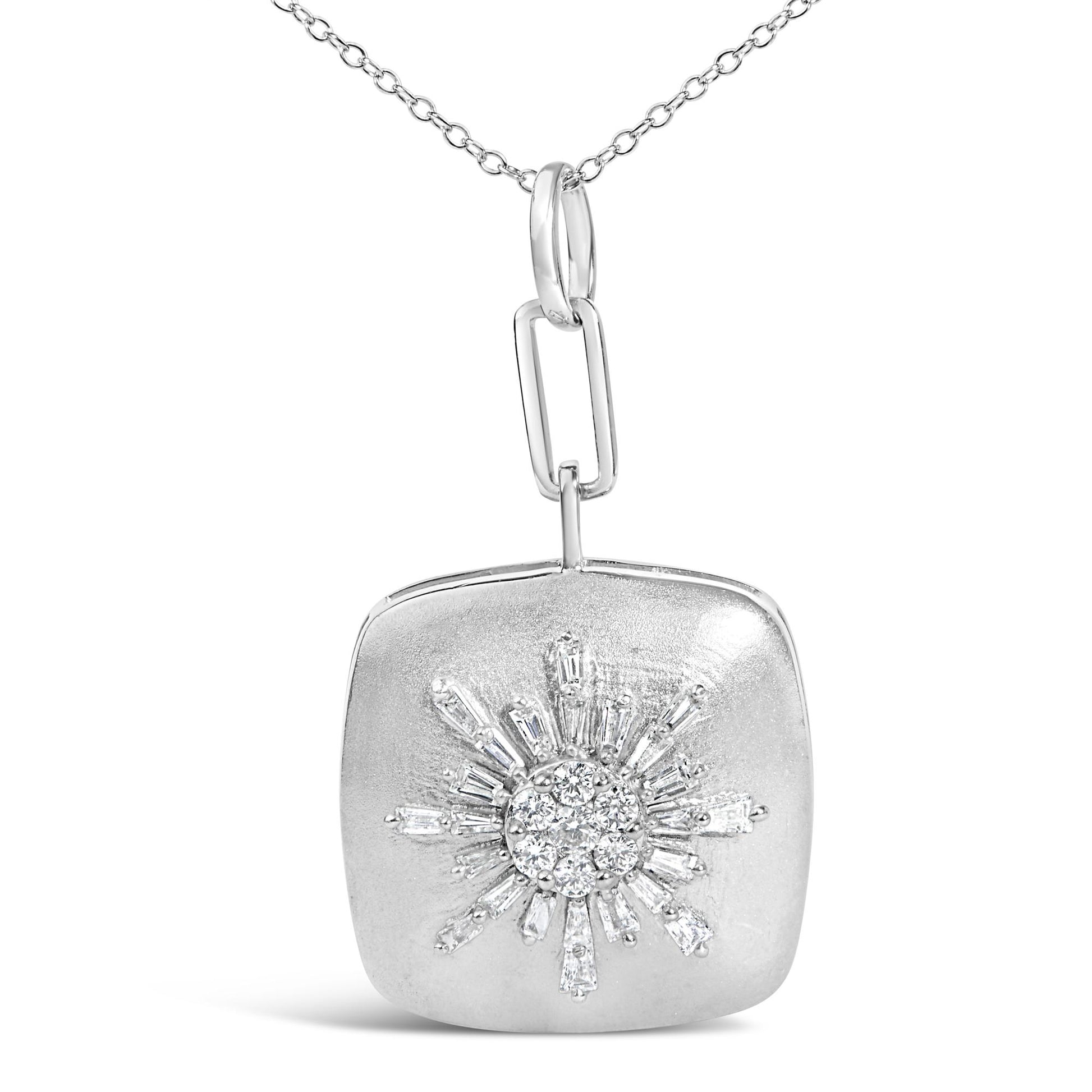 Close-up front view of a white metal necklace pendant with a sunburst design featuring baguette and round white gemstones.
