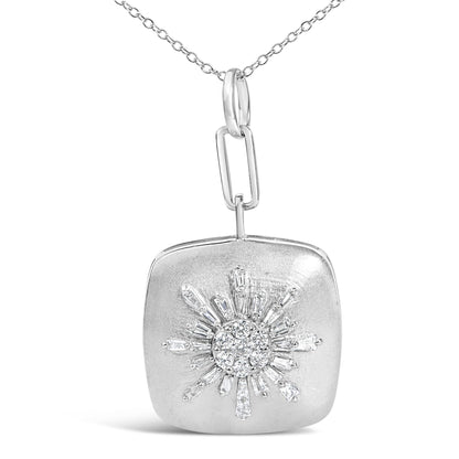 Close-up front view of a white metal necklace pendant with a sunburst design featuring baguette and round white gemstones.