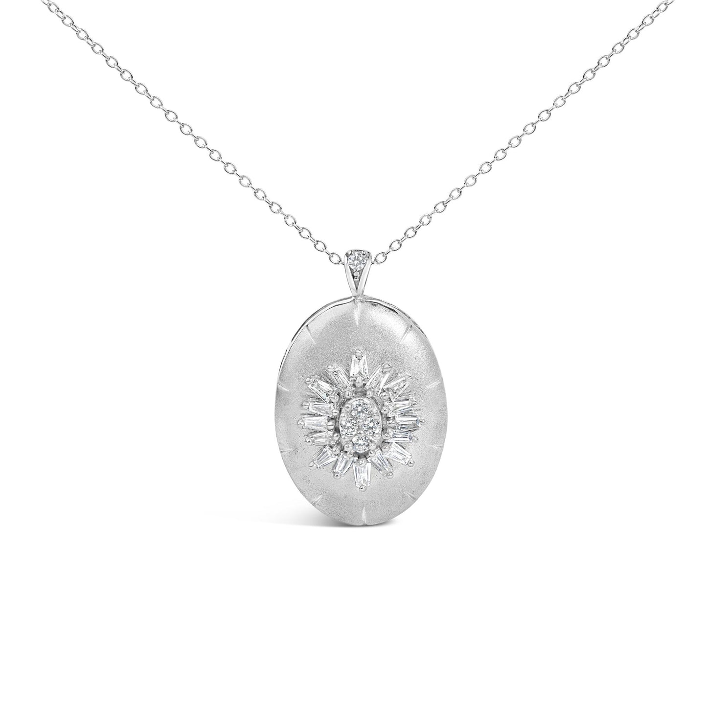 Close-up front view of a white metal necklace with an oval-shaped pendant featuring a cluster of prong-set white round and baguette-shaped gemstones in a sunburst pattern, shown on a white background.