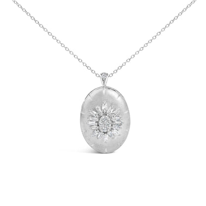 Close-up front view of a white metal necklace with an oval-shaped pendant featuring a cluster of prong-set white round and baguette-shaped gemstones in a sunburst pattern, shown on a white background.