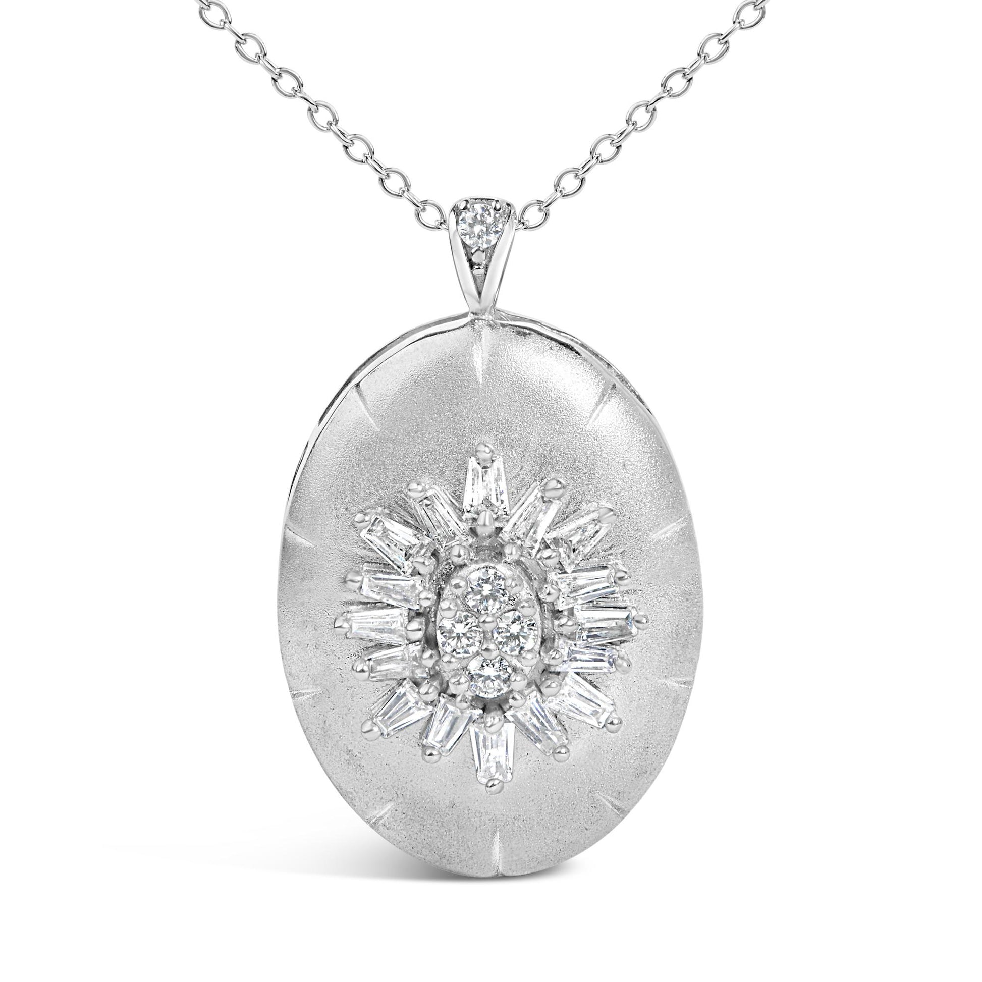 Close-up front view of a white metal necklace with an oval pendant featuring a starburst design composed of round and baguette-shaped white gemstones with prong settings. The necklace is shown on a white background.