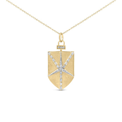 Close-up front view of a yellow metal necklace with a rectangular pendant featuring a starburst design made of white round and baguette-shaped gemstones, shown on a white background.