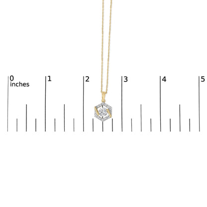Yellow necklace with a hexagonal pendant featuring a central round white gemstone surrounded by smaller white gemstones, shown hanging on a scale, front view.