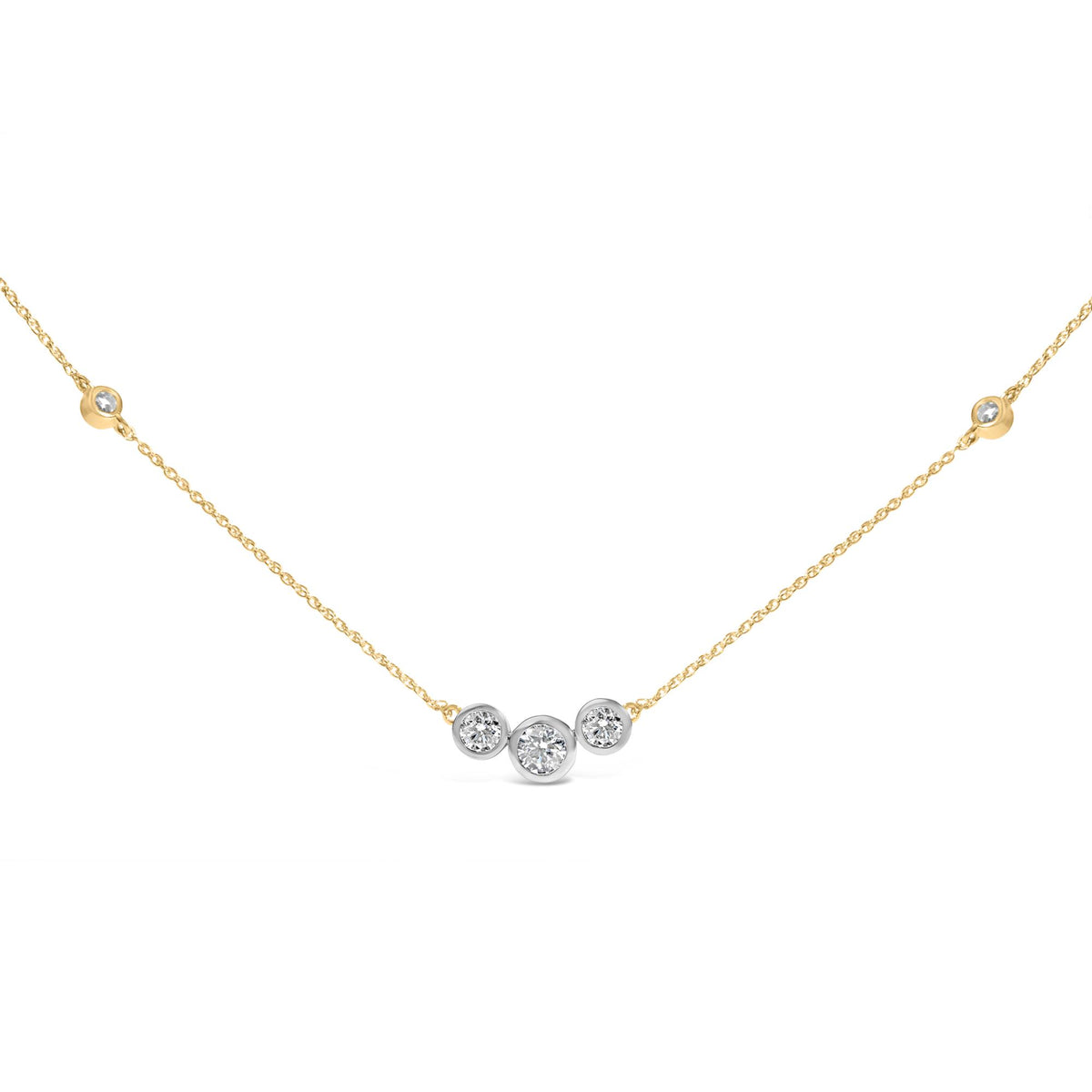 Close-up front view of a yellow metal necklace with a cluster of round white gemstones in bezel settings at the center, shown against a white background.