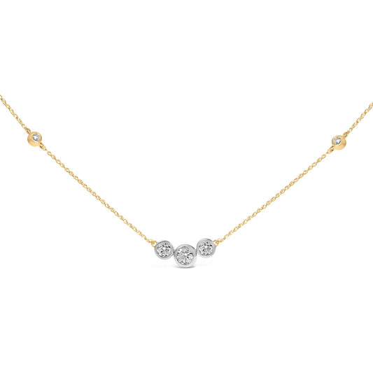 Front view of 10K yellow gold plated sterling silver 1.0 Cttw lab grown diamond bezel station necklace with three diamonds on white